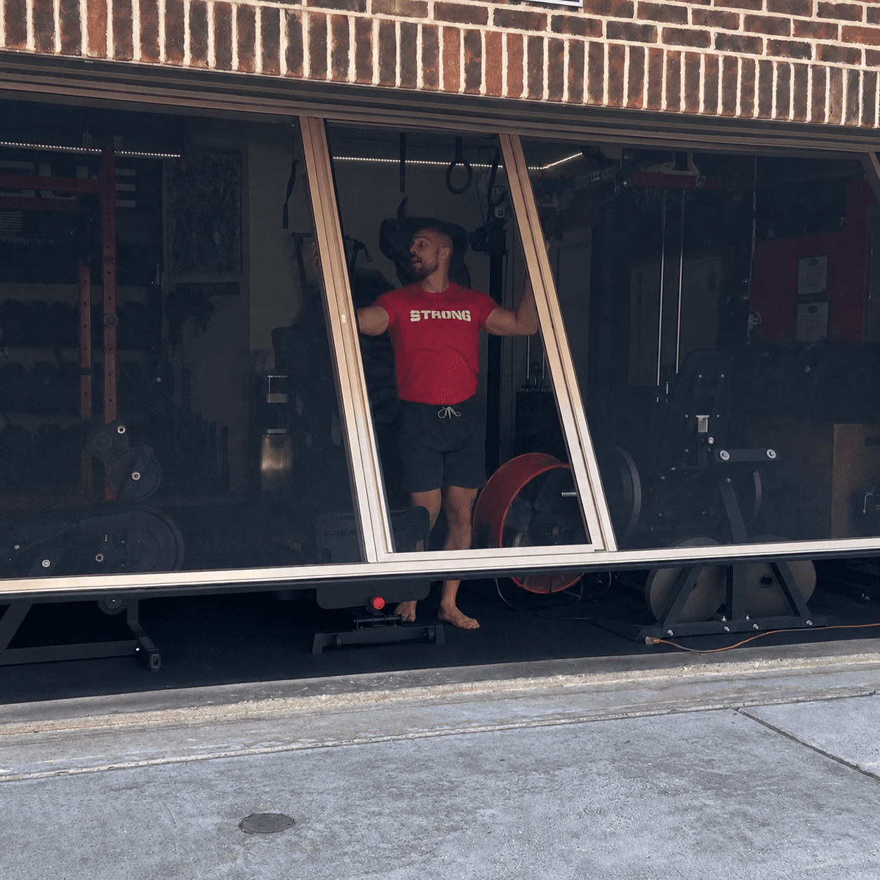 David behind the garage-door bug screen