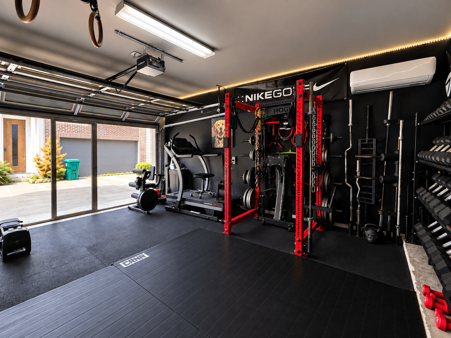The Gym training equipment and glass garage door